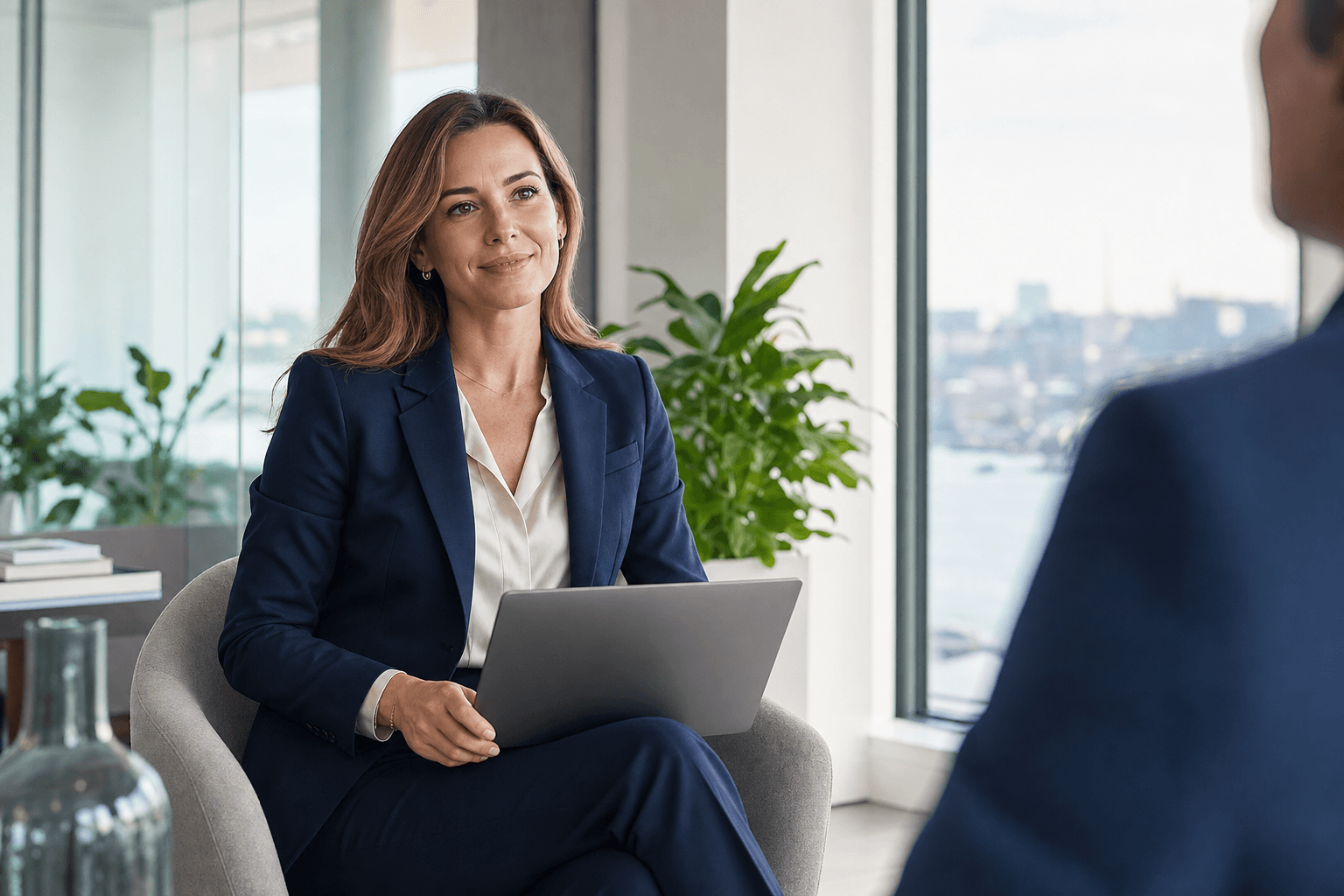 International professional consultant with laptop in elegant corporate environment